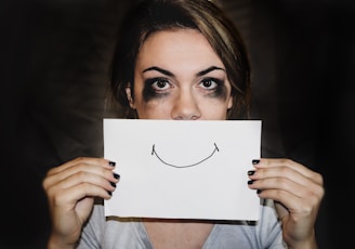 person holding white printer paper