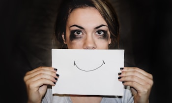 person holding white printer paper