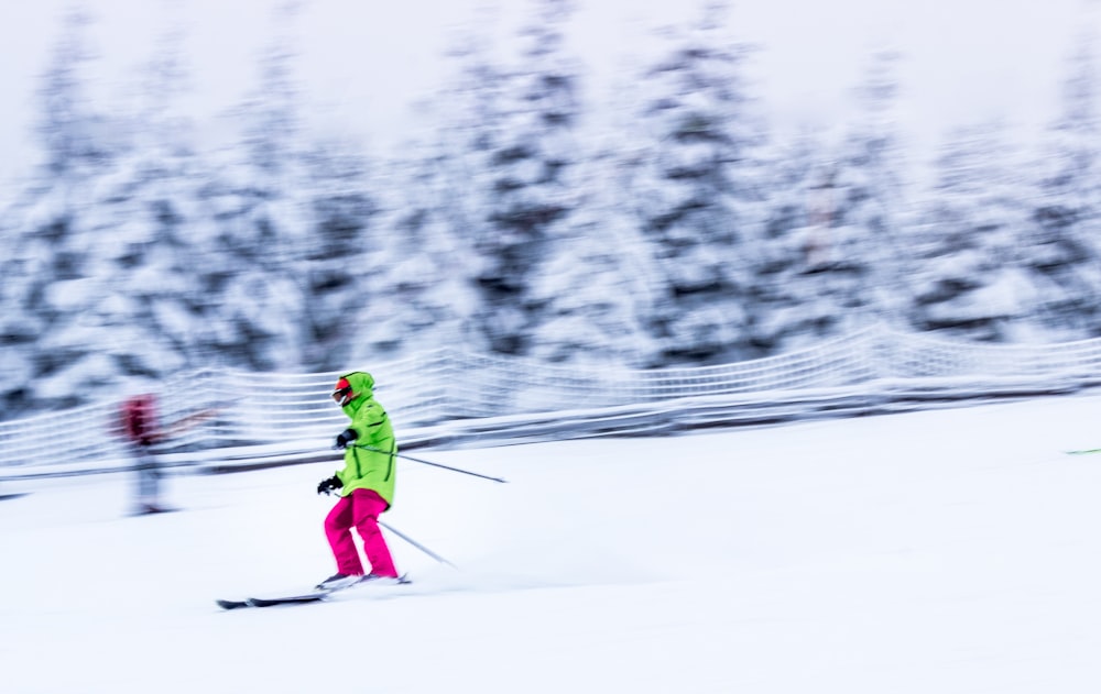 selective focus photography of person on ski blades at ski track