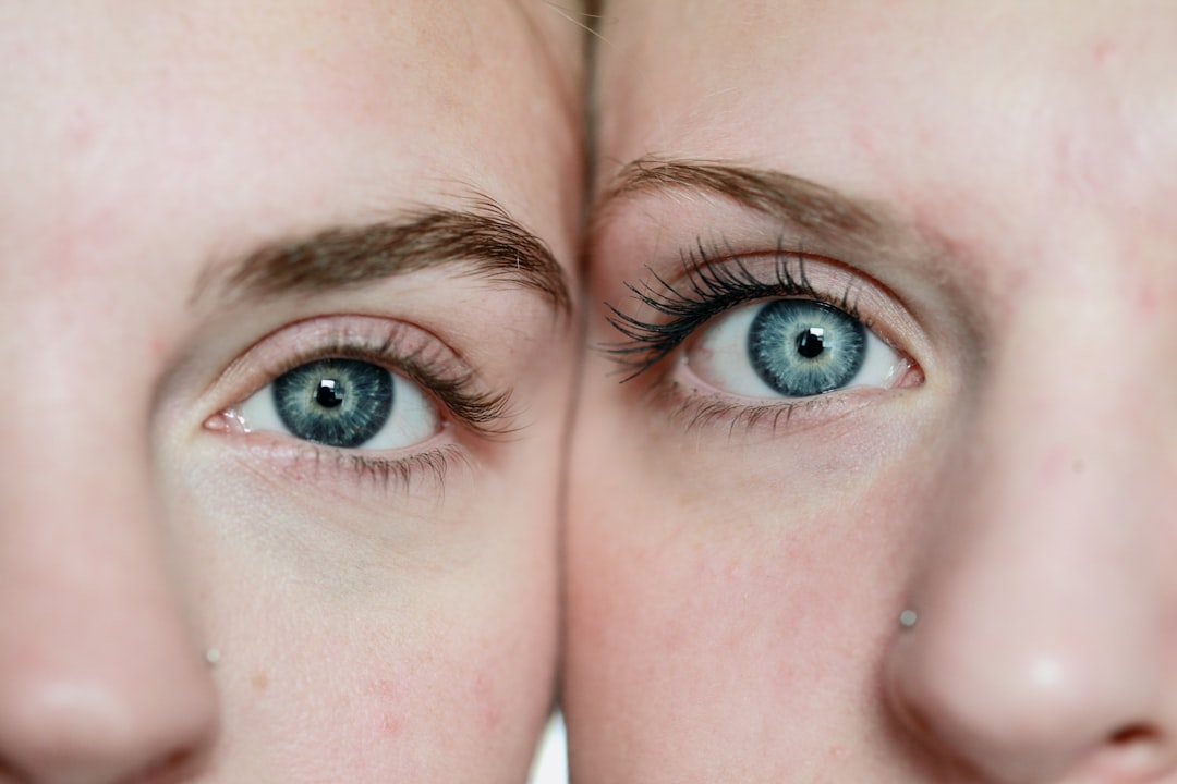 A close up macro shot of two girls with blue eyes. These girls are my two eldest daughters. I shot this using available natural light from a south facing window.