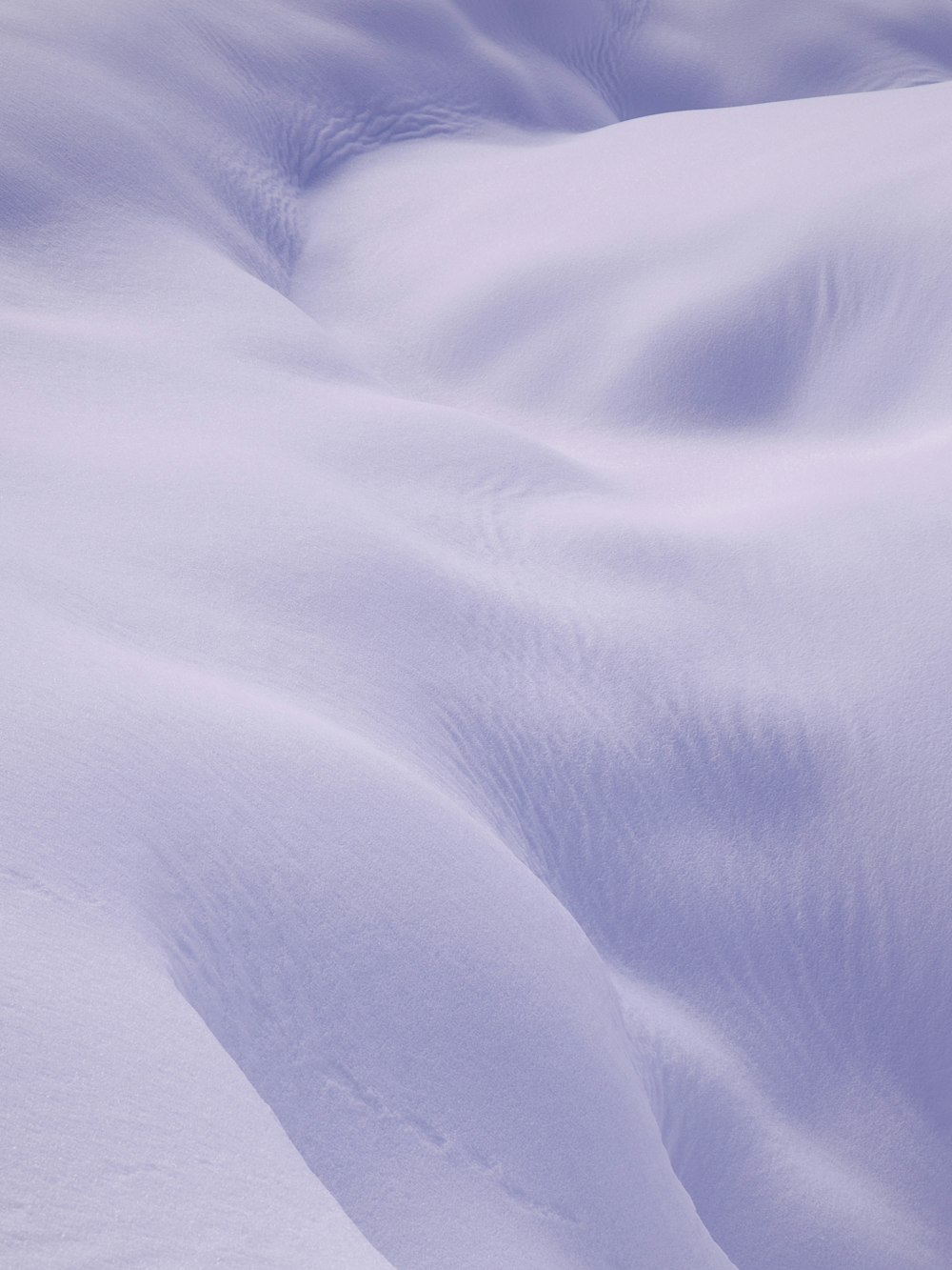 a person skiing down a snow covered slope