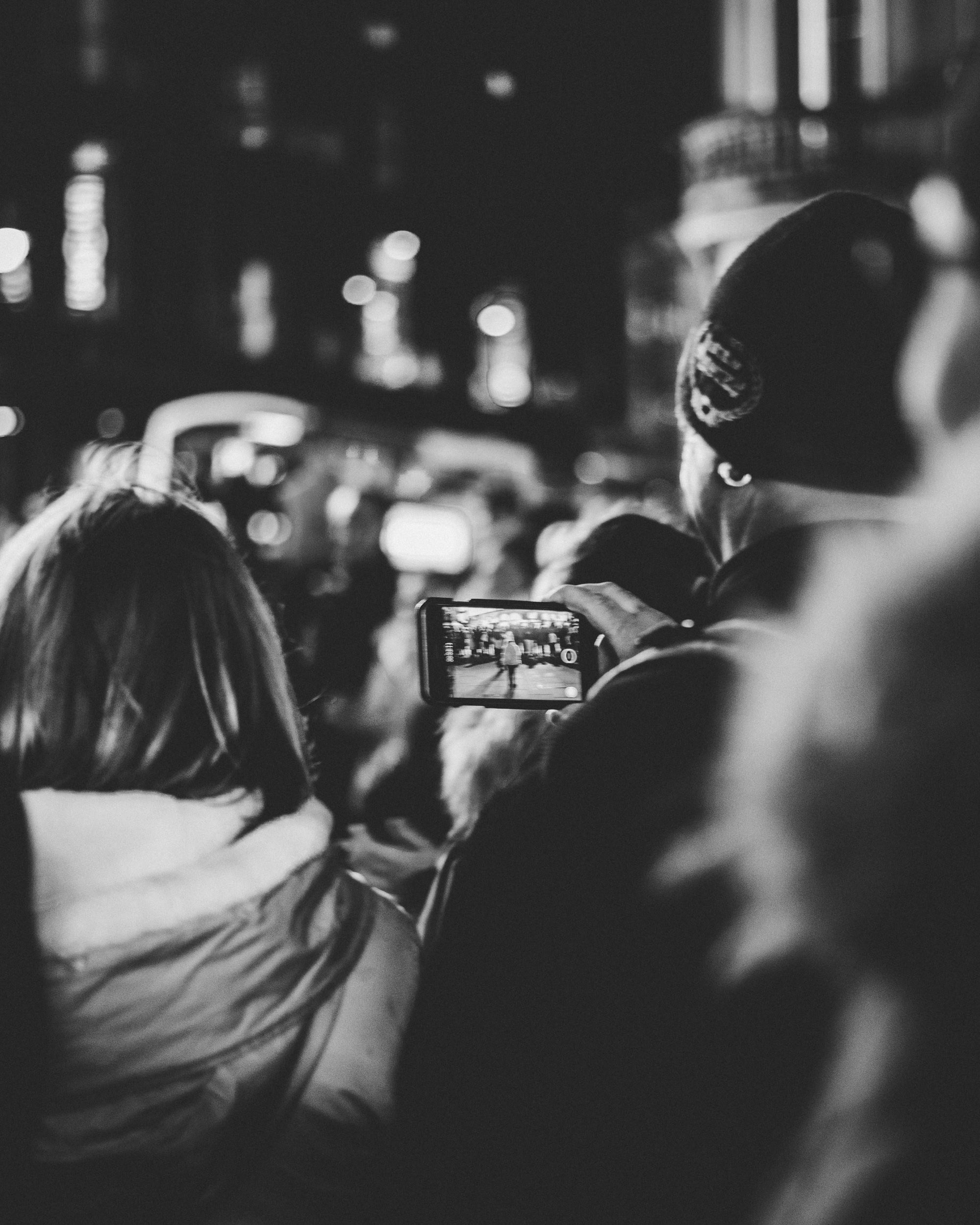 Diverse group of people engaging with Youtube Shorts on their smartphones