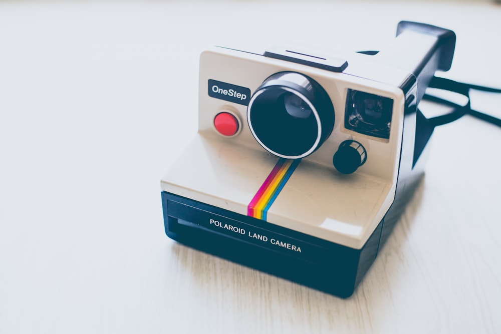 white and black Polaroid land camera