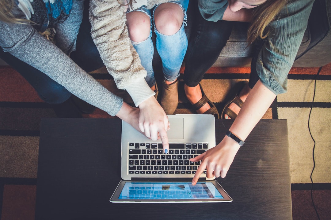 Team reviewing digital marketing tips on a laptop