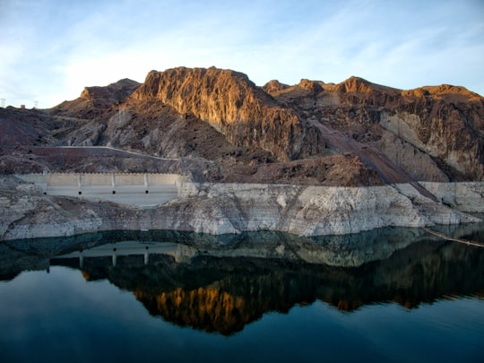 brown mountains beside body of water in Hoover Dam United States