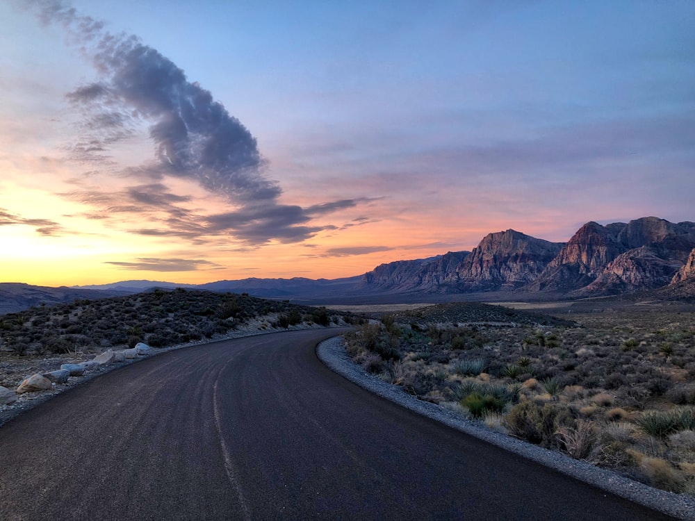 road near brown mountain range