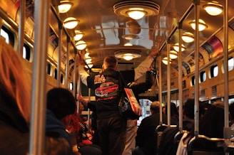 A busy bus interior filled with passengers.