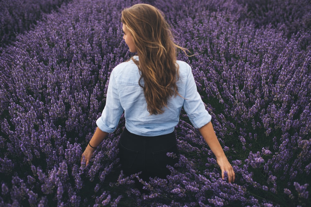 woman walking on lavender field