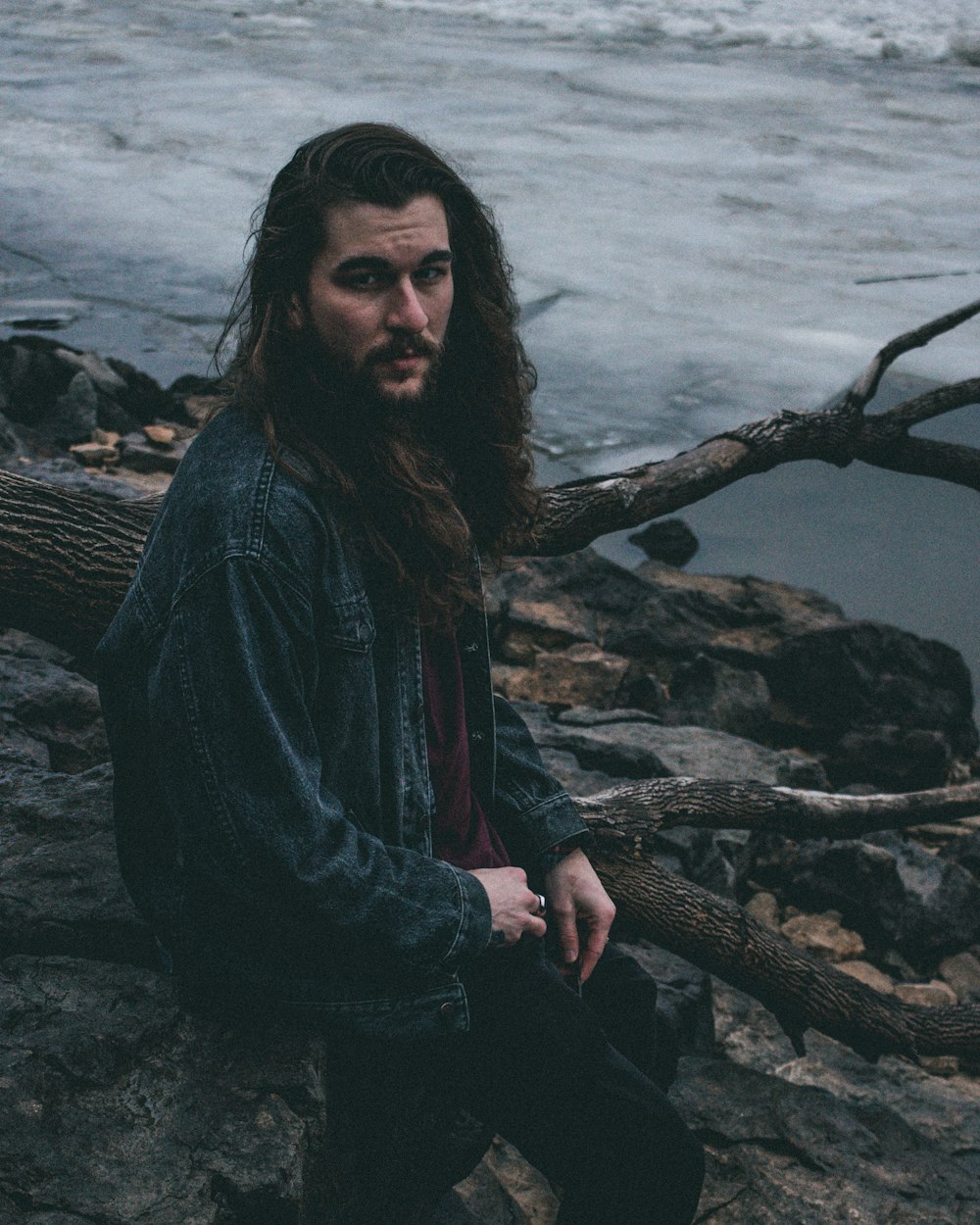 man sitting on rock formation