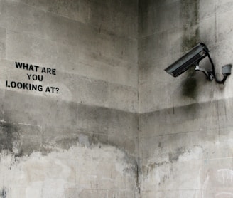 black CCTV camera on wall