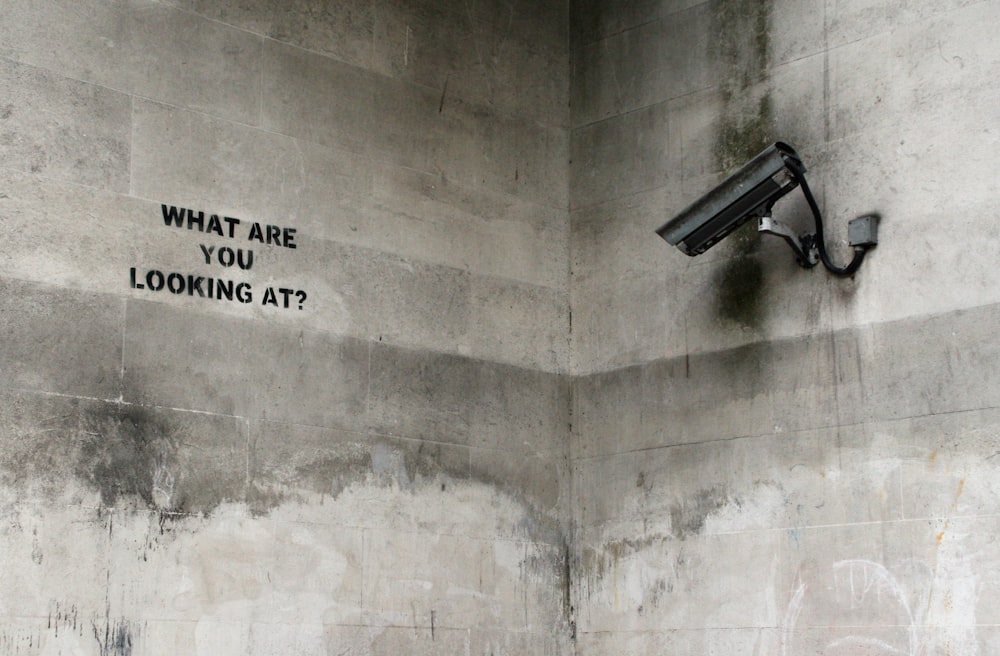 black CCTV camera on wall