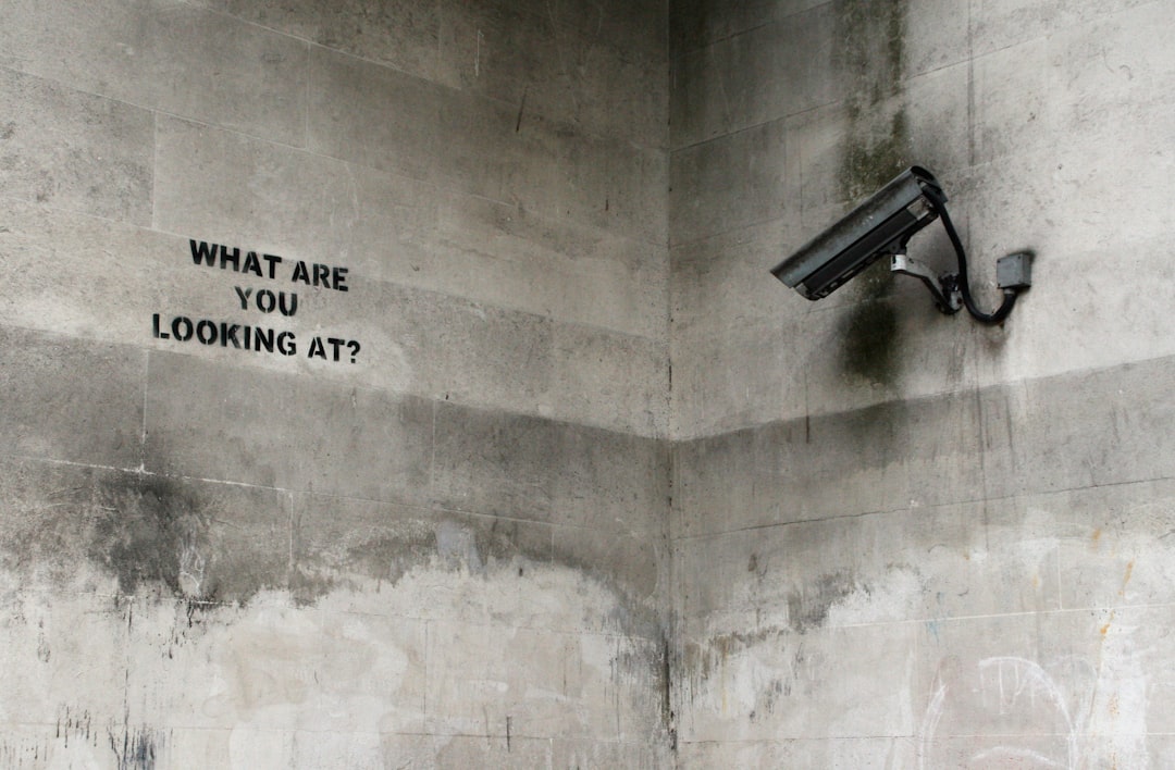 black CCTV camera on wall, Banksy, Marble Arch, London