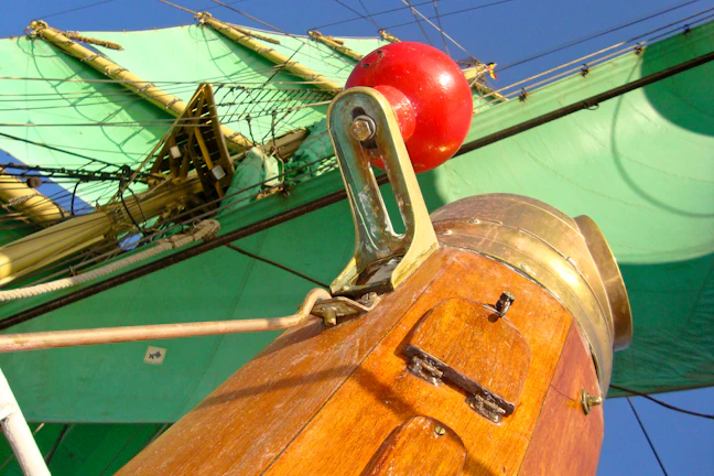 Detail of freshly painted sails fluttering gently in the breeze on the restored ship.