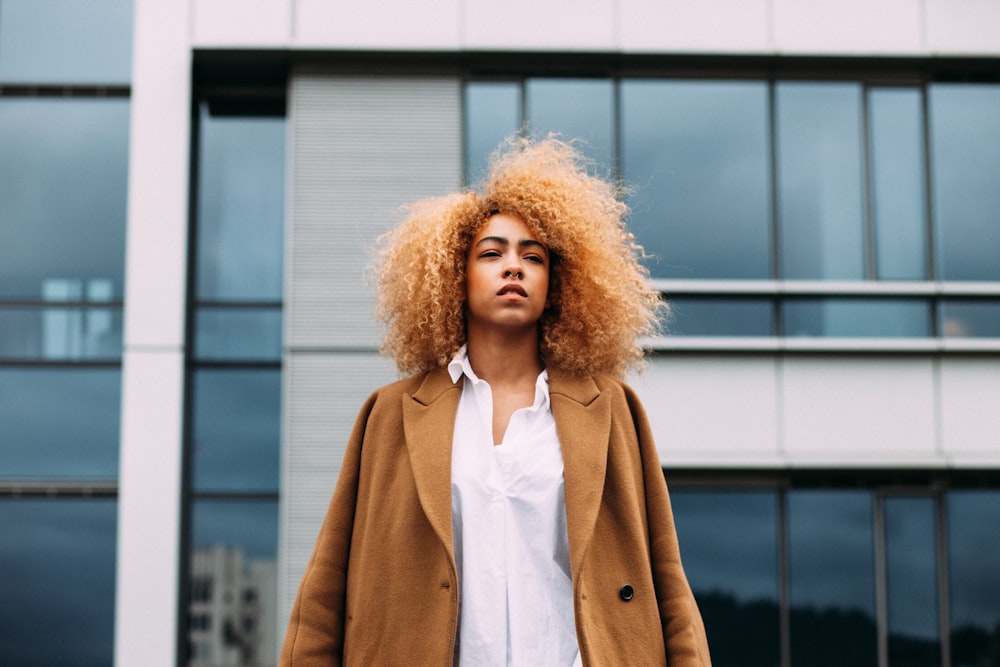 woman standing near concrete building