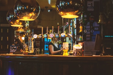 woman standing inside bar