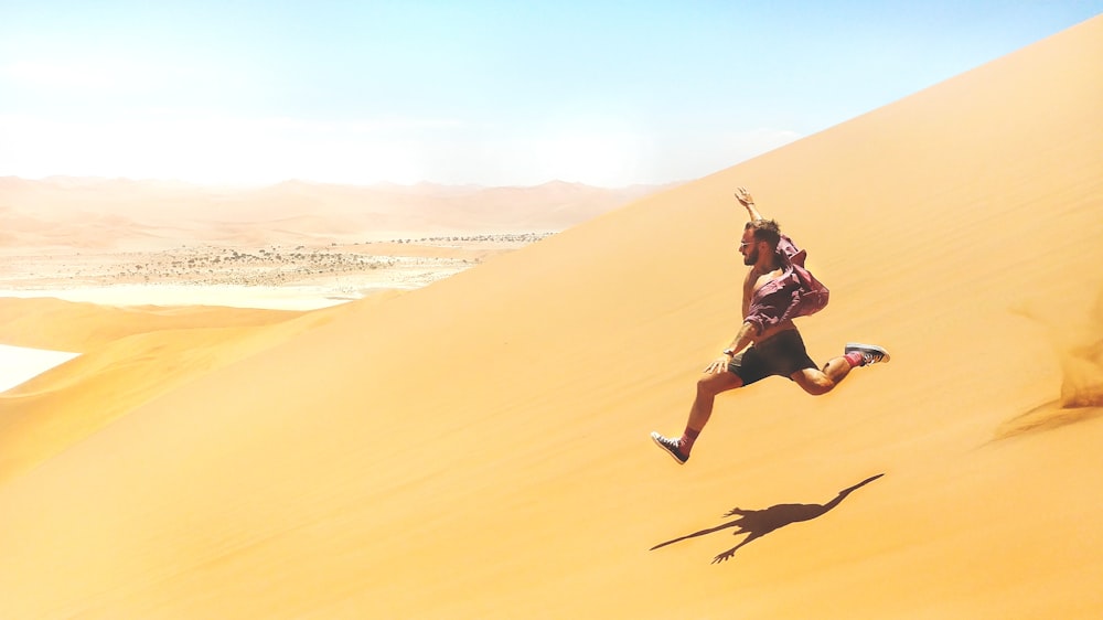 man running down on desert
