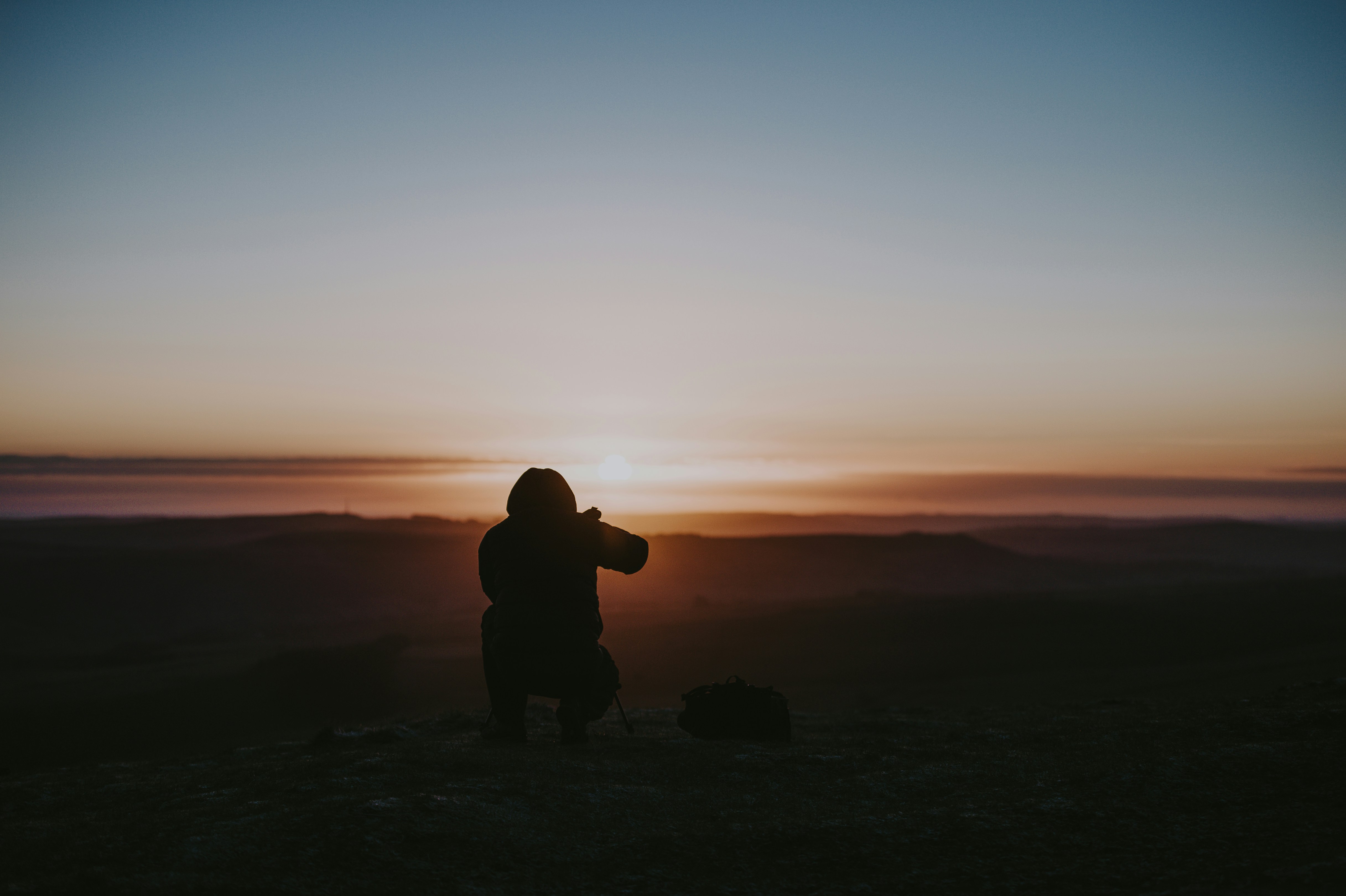 silhouette of person taking photo