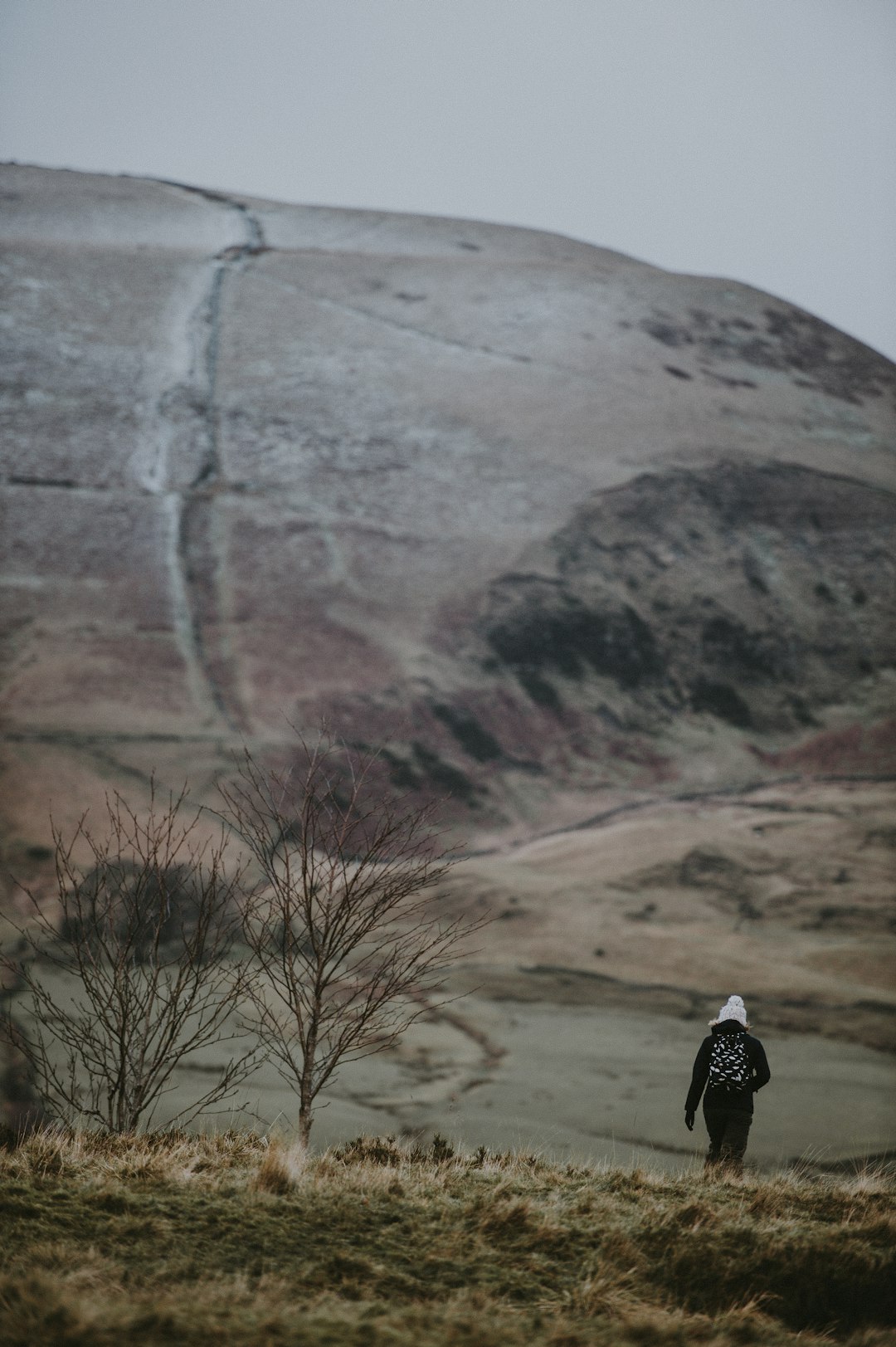 person wearing black jacket walking