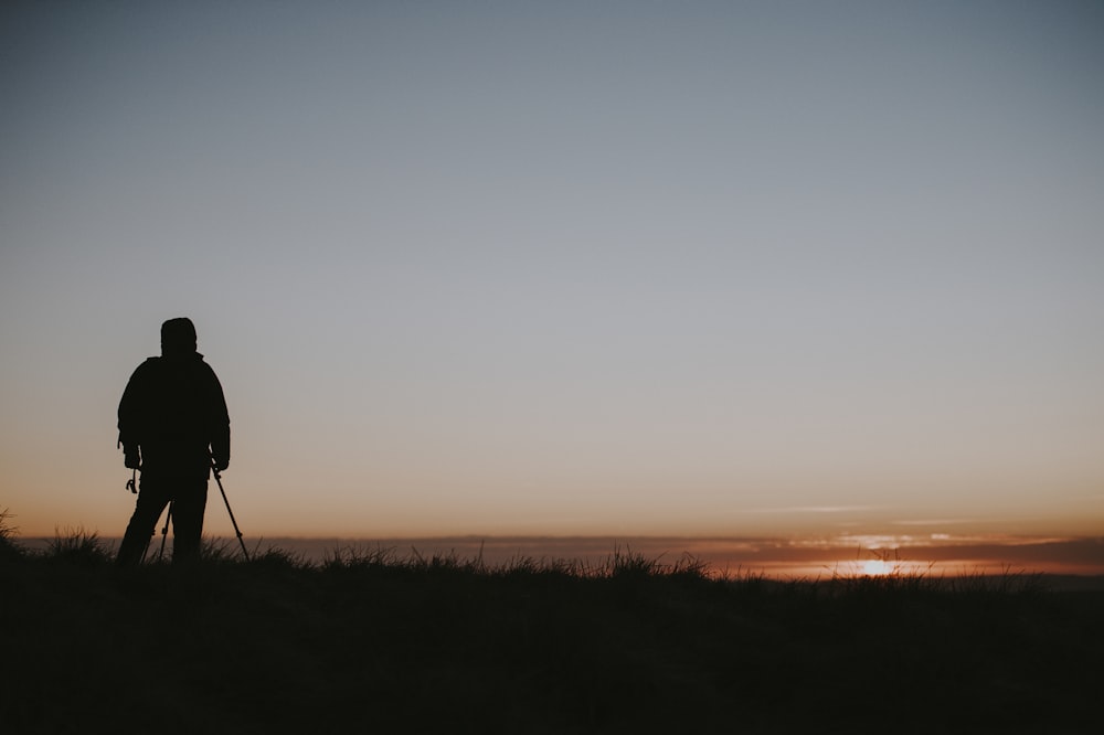 silhouette of person standing on ground