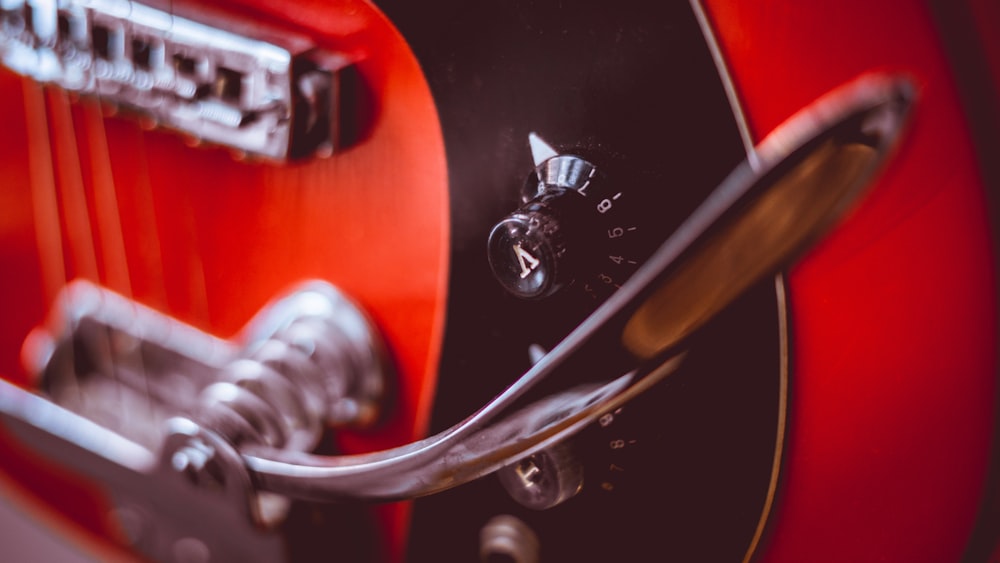 red and black electric guitar