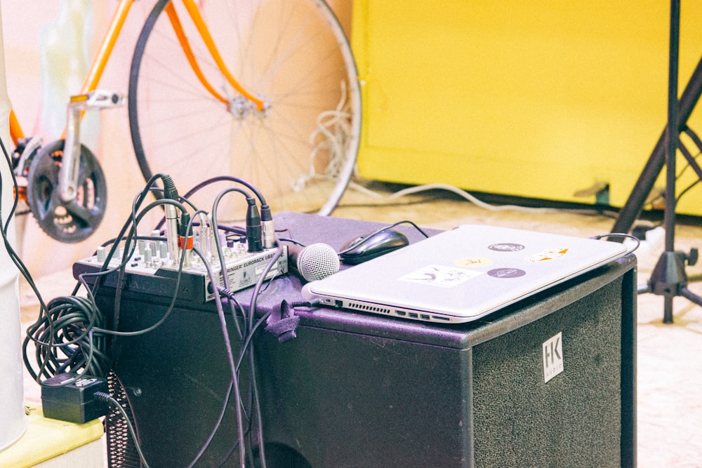 MacBook on top of PA speaker