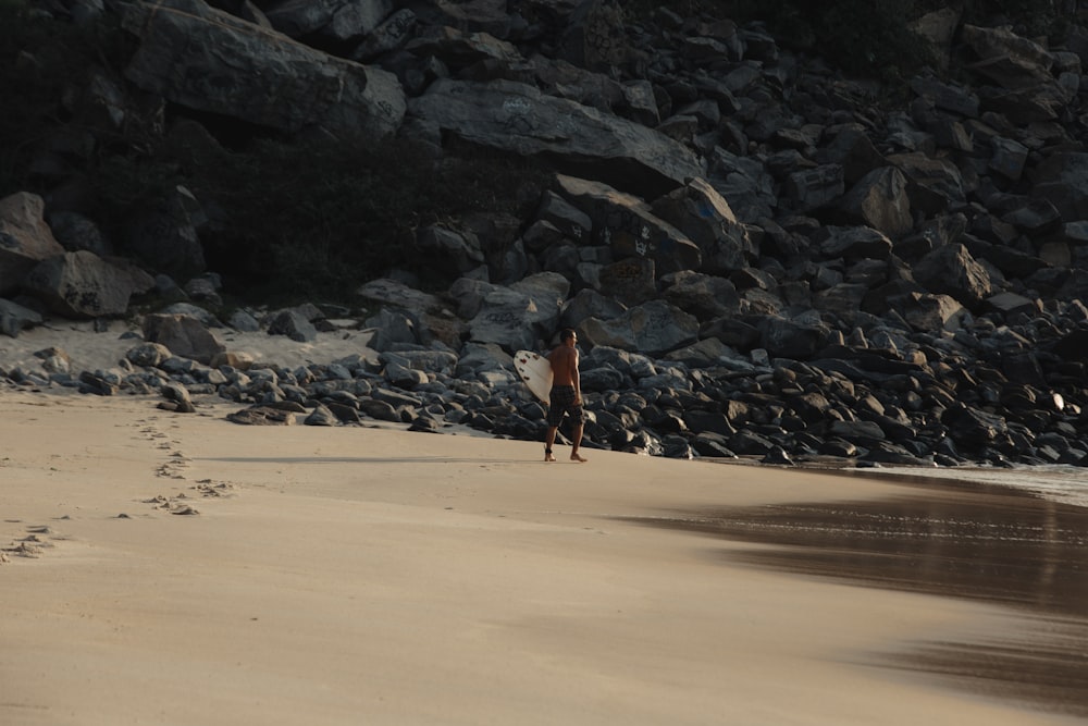 person standing near rock formations