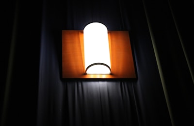 A beautifully lit custom lamp with a unique design showcased against a clean white background.