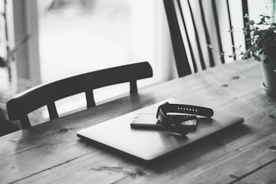 A minimalist workspace bathed in soft natural light featuring sleek design tools and a tablet.