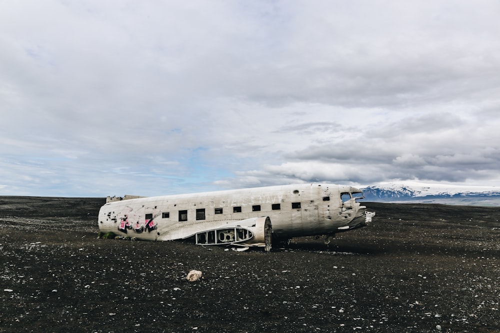 white wrecked airplane during daytime