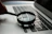 magnifying glass near gray laptop computer