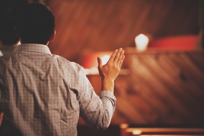 person raising hand