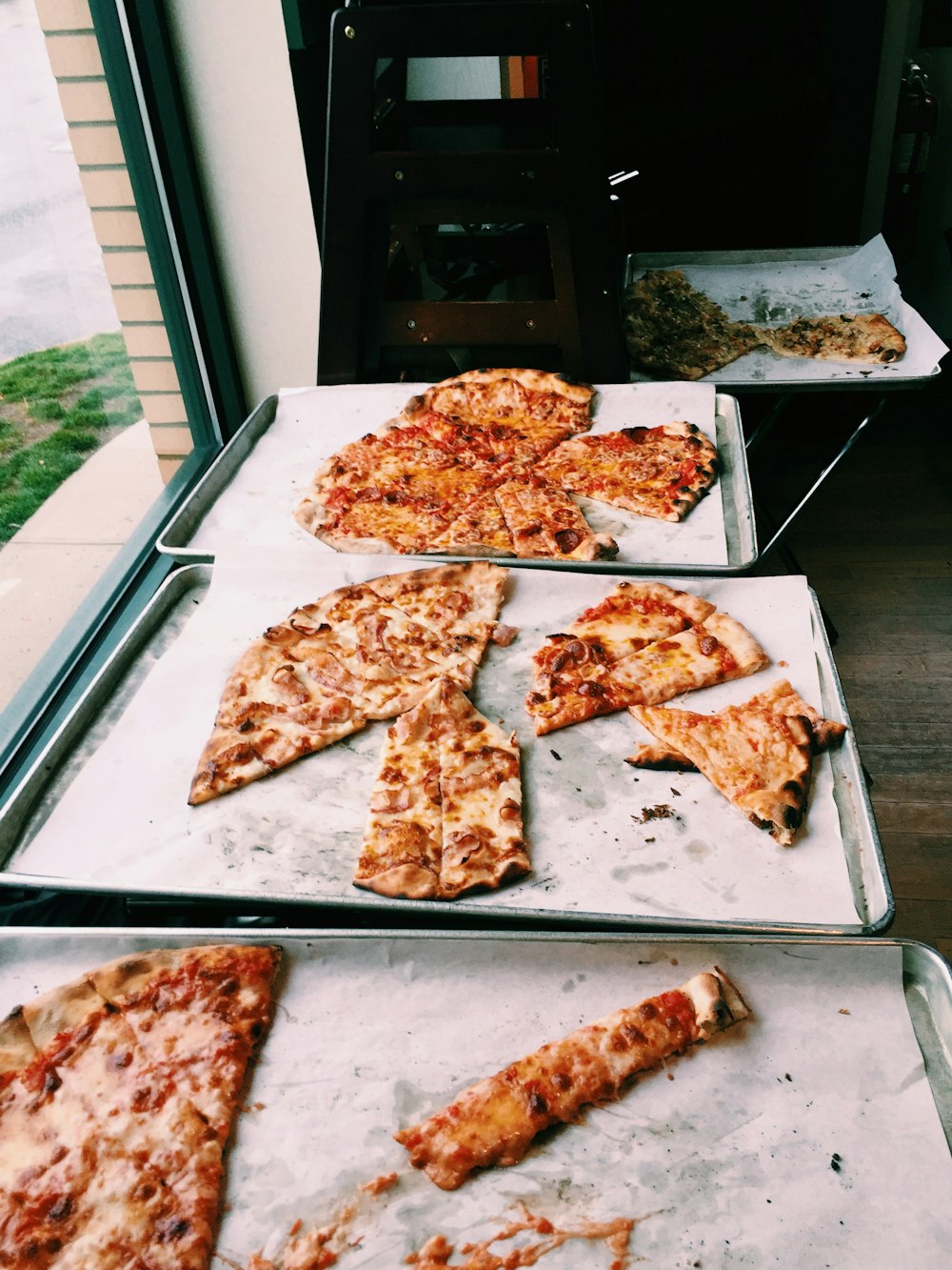 cooked pizza near window