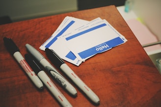 four markers on table