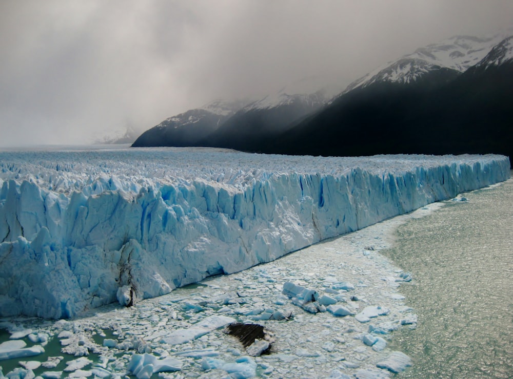 ice age near mountains at daytime