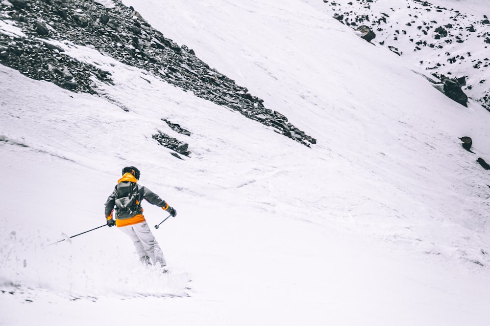 person skiing on snow at daytime