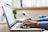 person typing on silver MacBook