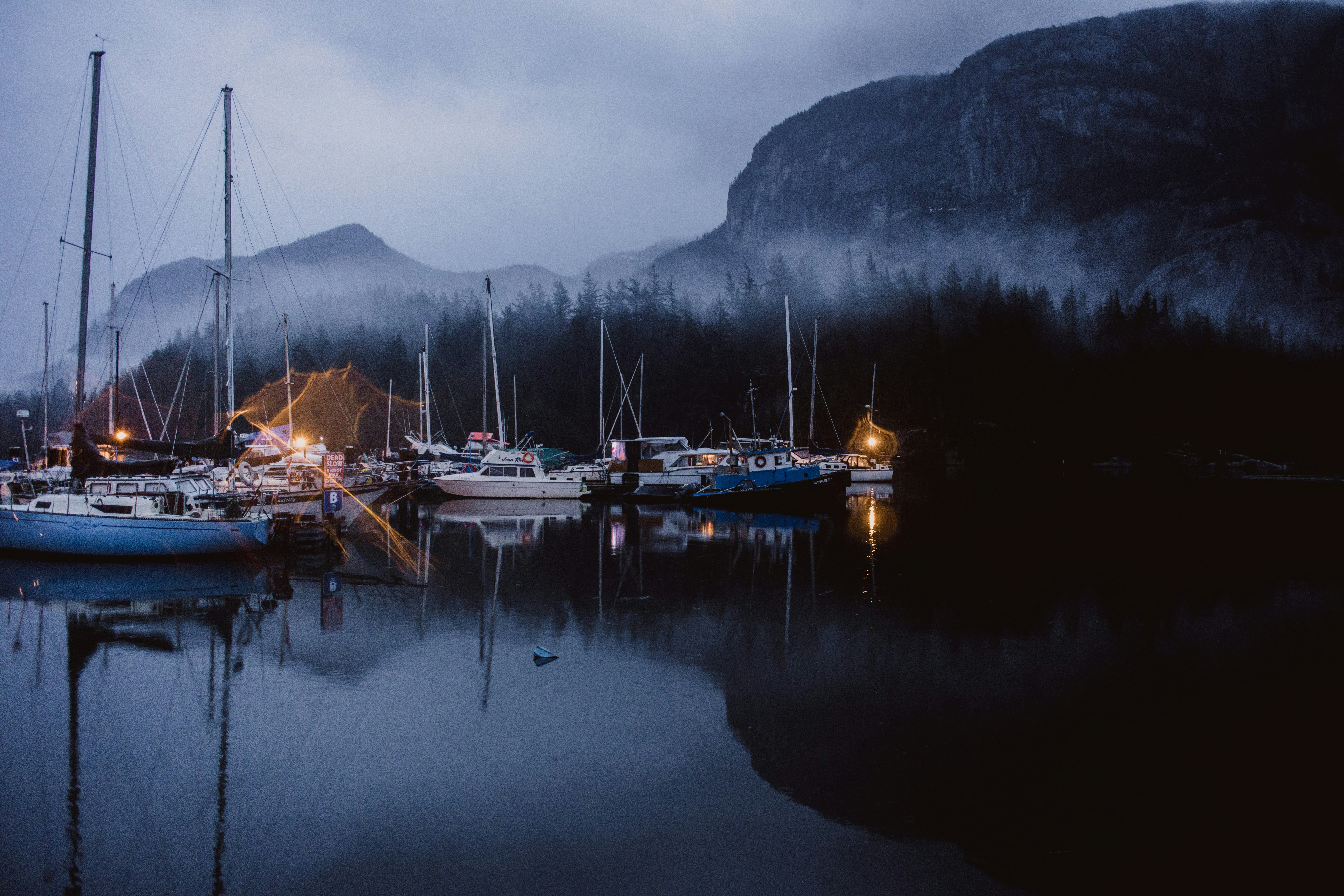 yacht beside mountains