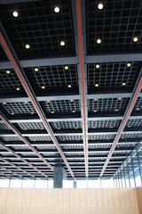 Suspended ceiling grid system in a bright office space