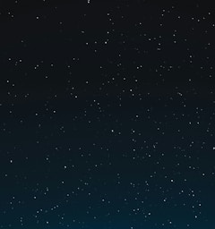 a night sky with stars and the moon