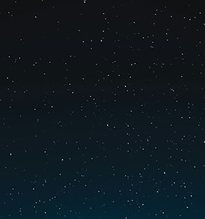 a night sky with stars and the moon