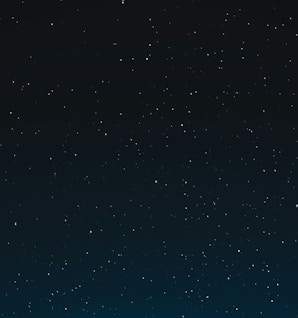 a night sky with stars and the moon