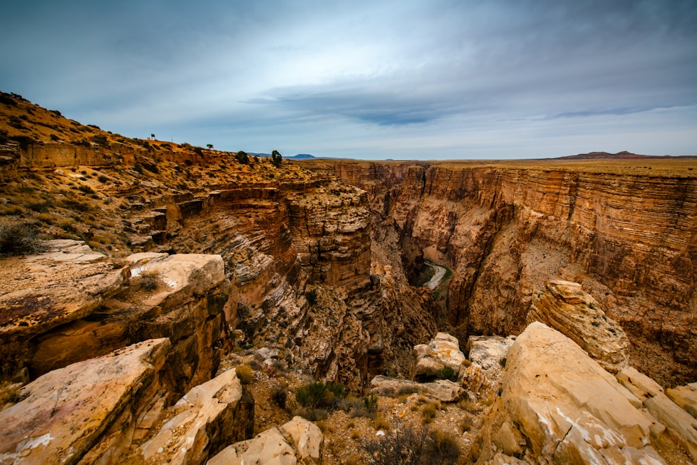 brown rocky mountain under cloudy sky