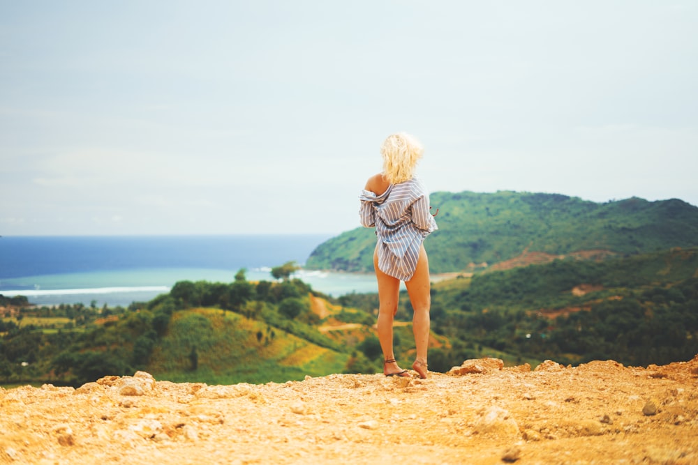 woman standing on brown soil