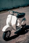 white and black motor scooter