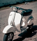 white and black motor scooter