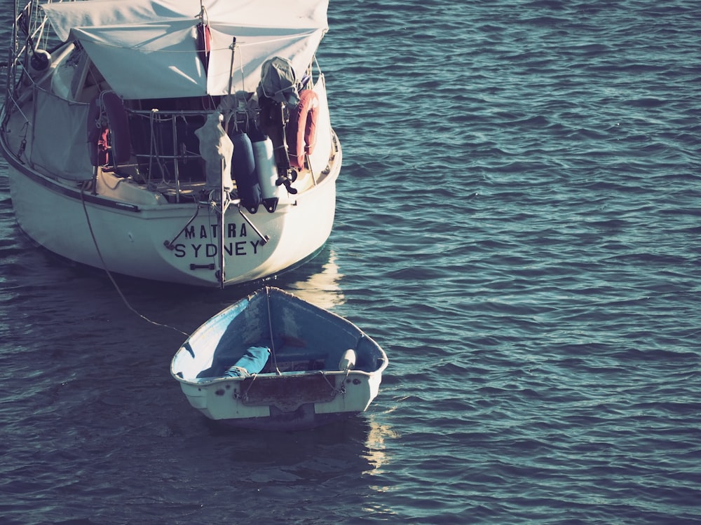 white boat on sea during daytime