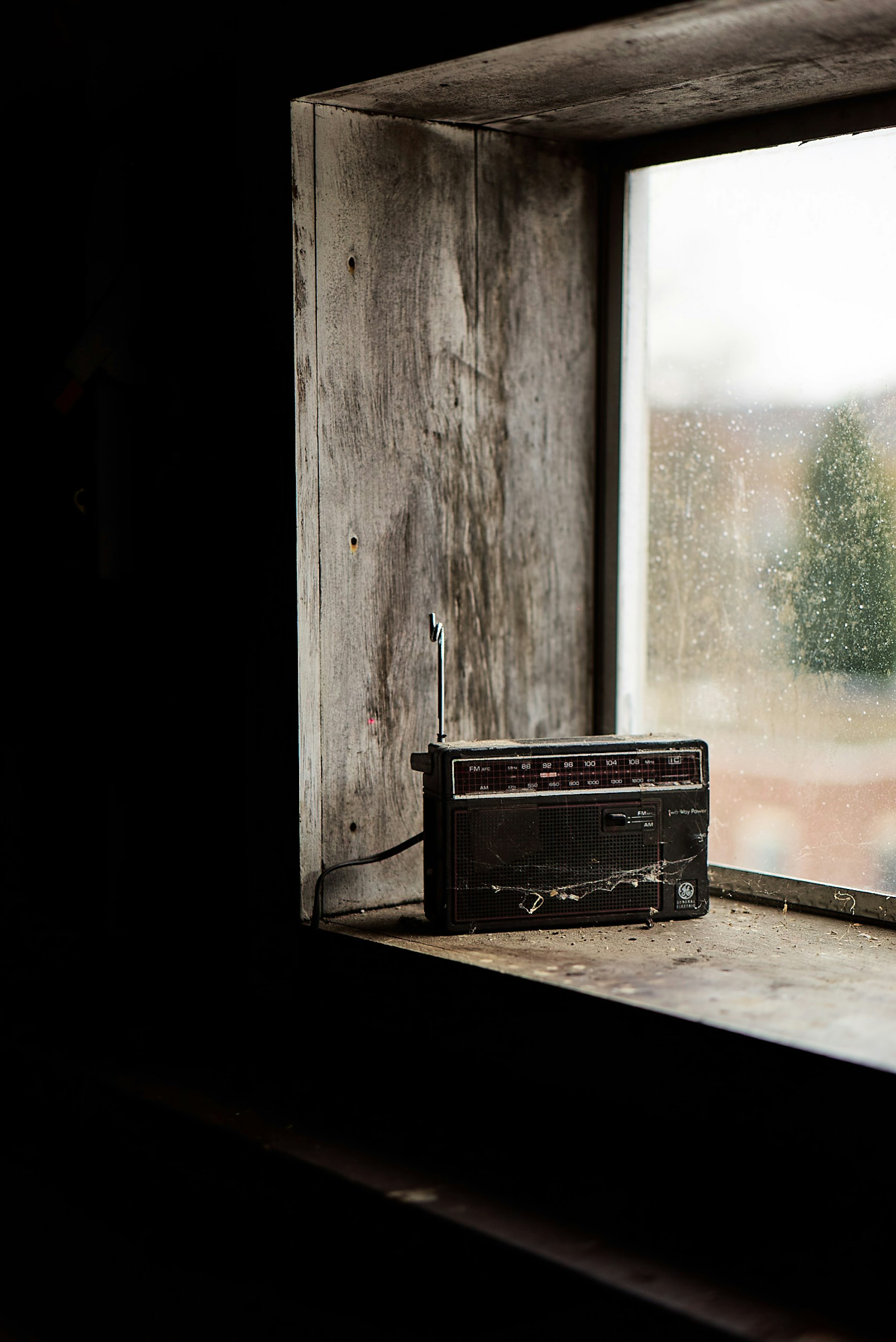 black boombox radio on top window