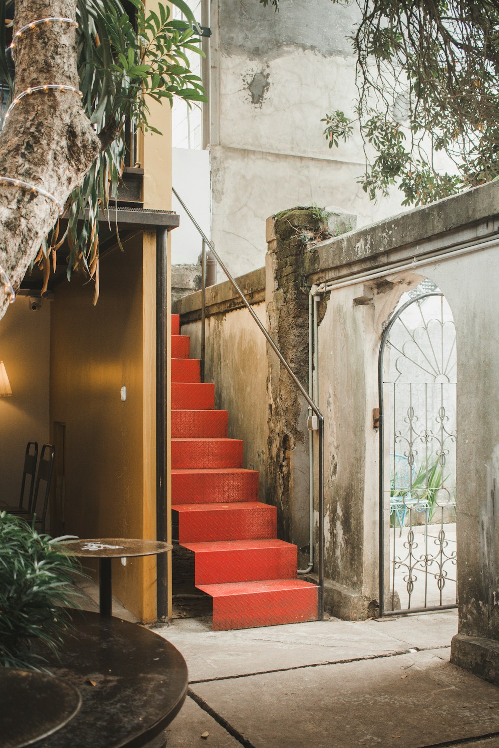 red metal stair beside building