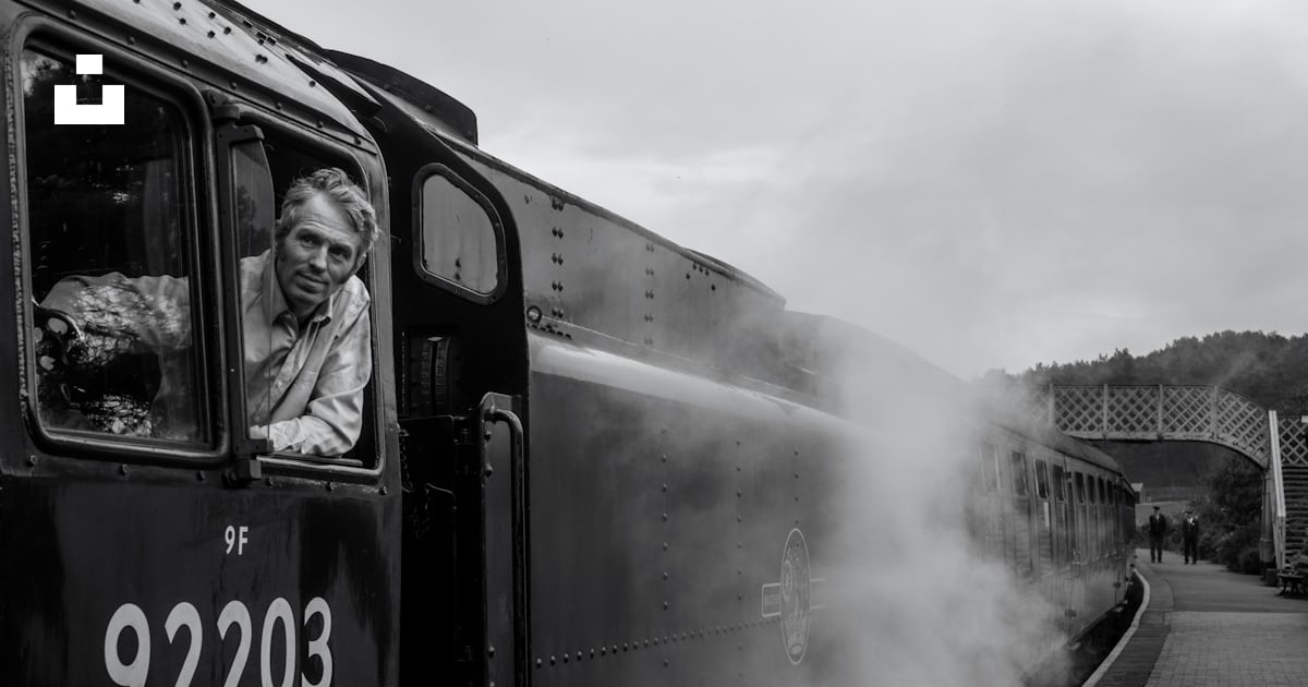 Grayscale photography of man riding train photo – Free Grey Image on ...