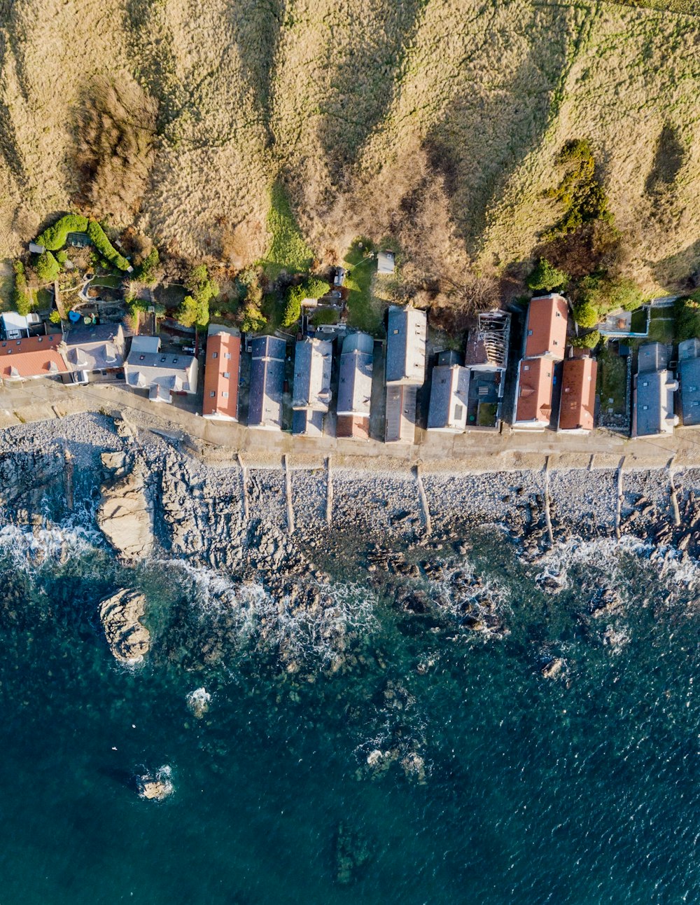 aerial photography of townhouse near body of water